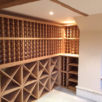 Large wine room using solid pine racking in Hampshire