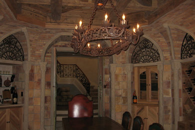 Example of a tuscan wine cellar design in Newark