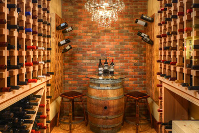 Mountain style linoleum floor wine cellar photo in Denver with storage racks