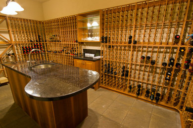 Wine cellar - large traditional brown floor wine cellar idea in Toronto with display racks