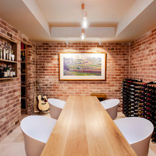 Design ideas for a large transitional wine cellar in Adelaide with storage racks and beige floor.