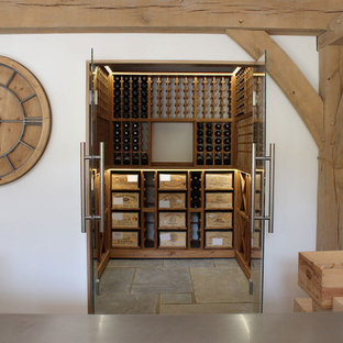 Medium sized wine cellar with glass door opening in West Sussex, UK.