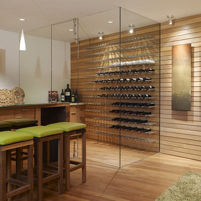 Trendy orange floor wine cellar photo in Other