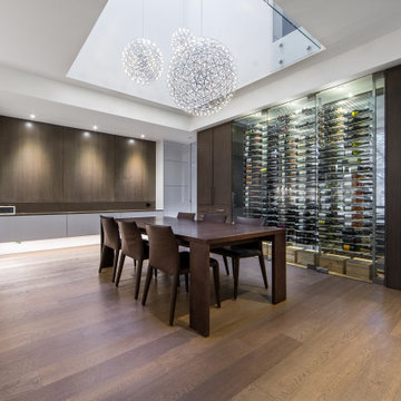 Modern Wine Cellar With Sleek Racking, Enclosed In Glass