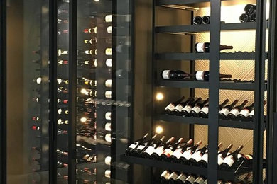 Modern Wine Wall with Sliding Trays and Metal Racking
