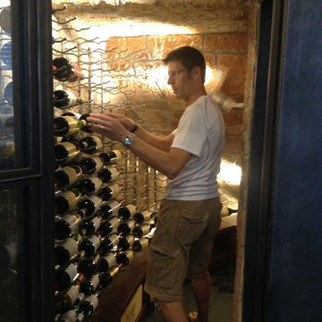 Mr. Meyer Stocking His Wine in His Dallas Custom Wine Cellar