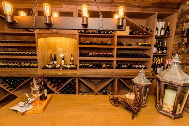 Example of a mountain style wine cellar design in Toronto