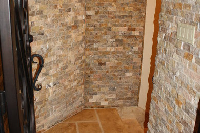 Mountain style wine cellar photo in Other