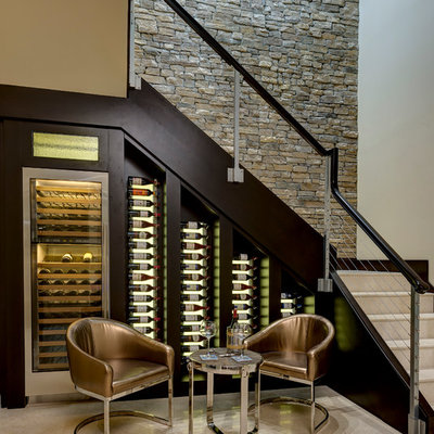 Small transitional beige floor wine cellar photo in Orlando with display racks