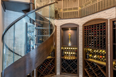 Example of a transitional wine cellar design in Orlando with storage racks