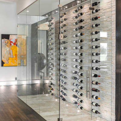 Wine cellar - small contemporary beige floor wine cellar idea in Tampa with display racks