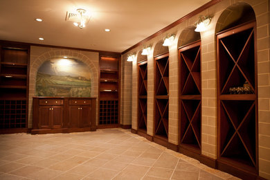 Wine cellar - mid-sized mediterranean ceramic tile and beige floor wine cellar idea in Boston with display racks