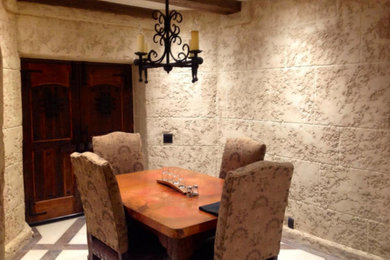 Example of a mid-sized tuscan limestone floor and beige floor wine cellar design in San Francisco