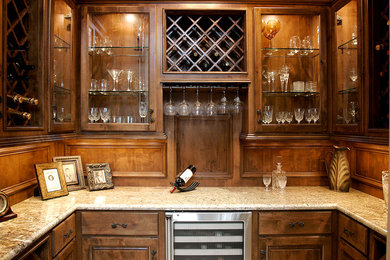Wine cellar - mid-sized traditional wine cellar idea in Houston with storage racks