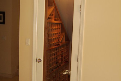 Mid-sized trendy wine cellar photo in Los Angeles with storage racks