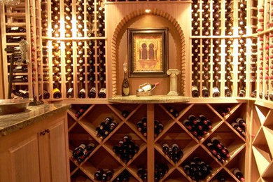 Mid-sized tuscan wine cellar photo in Salt Lake City with storage racks