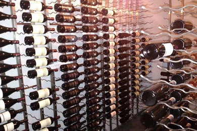 Mid-sized tuscan wine cellar photo in Salt Lake City with storage racks