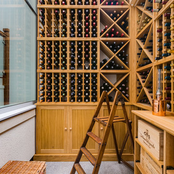Private residential wine room in London with large glass frontage, made from oak