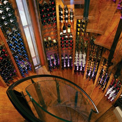 Eclectic medium tone wood floor wine cellar photo in Other with storage racks