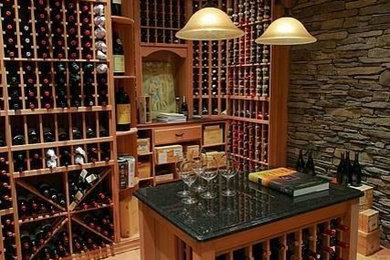 Wine cellar - large traditional terra-cotta tile wine cellar idea in Philadelphia with storage racks