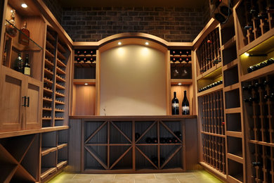 Inspiration for a large transitional porcelain tile and gray floor wine cellar remodel in Portland with diamond bins