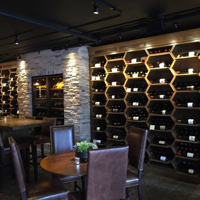 Large arts and crafts wine cellar photo in San Francisco with display racks