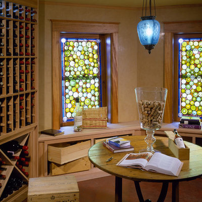 Wine cellar - traditional brown floor wine cellar idea in Boston with display racks