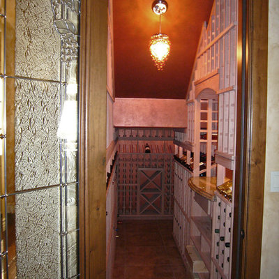 Inspiration for a large craftsman wine cellar remodel in Sacramento with storage racks
