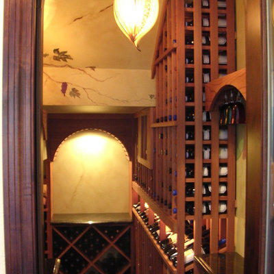 Wine cellar - large craftsman wine cellar idea in Sacramento with storage racks
