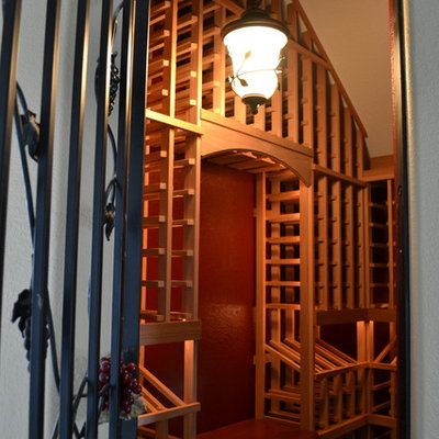 Wine cellar - mid-sized craftsman wine cellar idea in Sacramento with storage racks