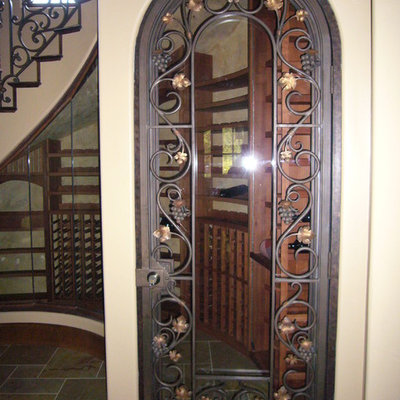 Wine cellar - large craftsman wine cellar idea in Sacramento with storage racks