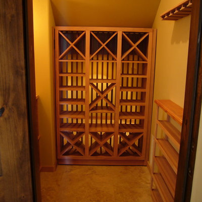 Wine cellar - mid-sized craftsman wine cellar idea in Sacramento with diamond bins
