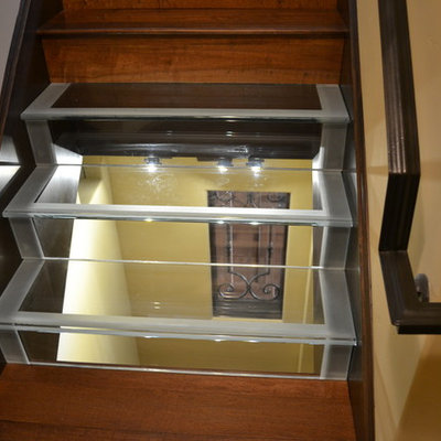 Example of a large arts and crafts wine cellar design in Sacramento with storage racks