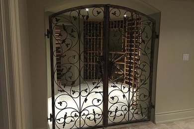 This is an example of a medium sized contemporary wine cellar in Toronto with ceramic flooring, storage racks and beige floors.