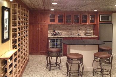 Example of a mid-sized arts and crafts wine cellar design in Cleveland with storage racks