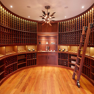 The Curve Wine Cellar with Rolling Ladder | by Genuwine Cellars