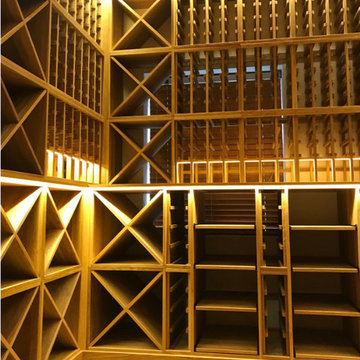 Three sided private wine room in Esher, Surrey using solid Oak racking