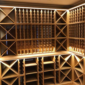 Three sided private wine room in Esher, Surrey using solid Oak racking