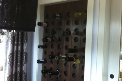 Eclectic wine cellar photo in Vancouver