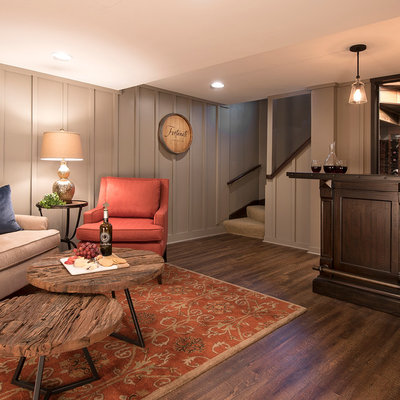 Inspiration for a mid-sized timeless dark wood floor wine cellar remodel in Milwaukee with storage racks