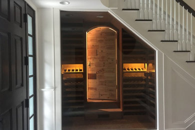Small elegant cork floor wine cellar photo in New York