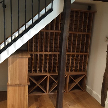Under stairs wine racking in a private Hertfordshire home, racks & cubes in oak
