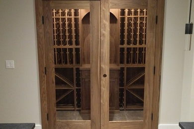 Wine cellar - transitional wine cellar idea in Calgary