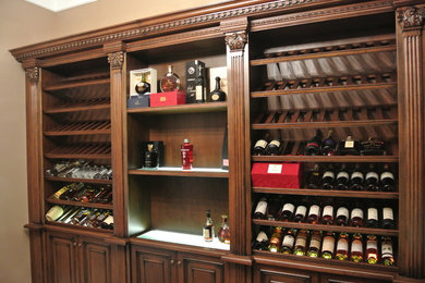 Photo of a large traditional wine cellar in Moscow with marble flooring and storage racks.