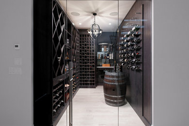 Example of a trendy gray floor wine cellar design in Vancouver with storage racks