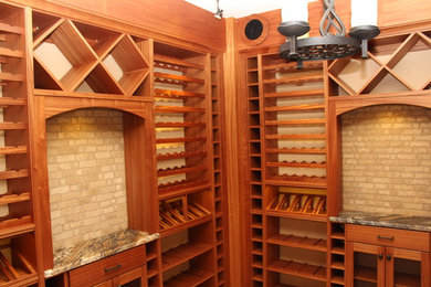 Inspiration for a large timeless wine cellar remodel in Denver with display racks