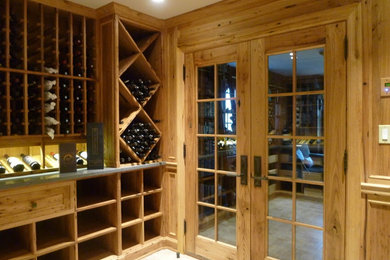 This is an example of a medium sized bohemian wine cellar in New York.