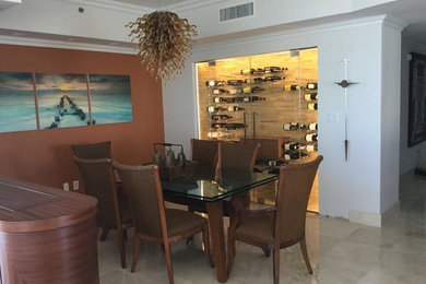 Medium sized contemporary dining room in Miami with terracotta flooring and beige floors.
