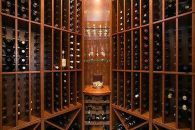 Example of a small classic wine cellar design in San Diego with diamond bins