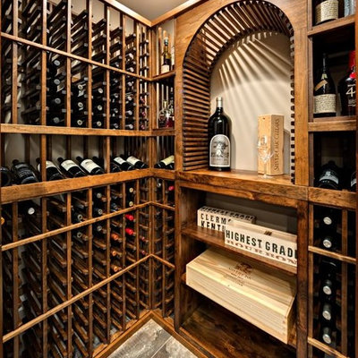Example of a large arts and crafts wine cellar design in Minneapolis with storage racks